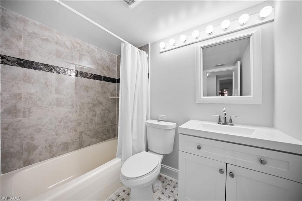 666 3rd Street South, Unit 106 Naples, FL 34102 - Photo 17 of 32 a bathroom with a sink toilet and shower