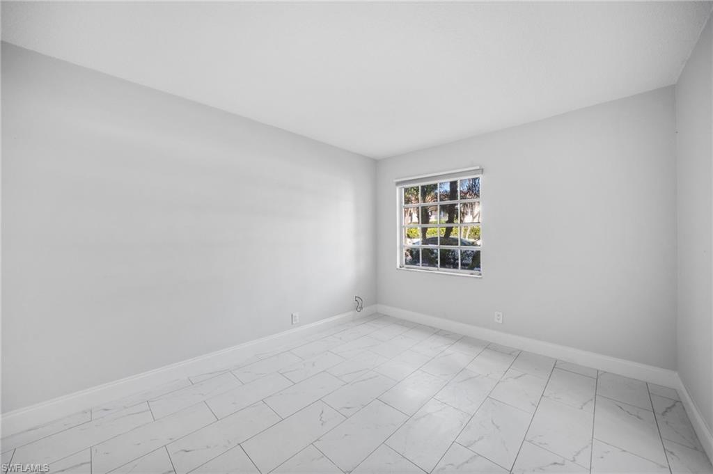 666 3rd Street South, Unit 106 Naples, FL 34102 - Photo 20 of 32 an empty room with windows