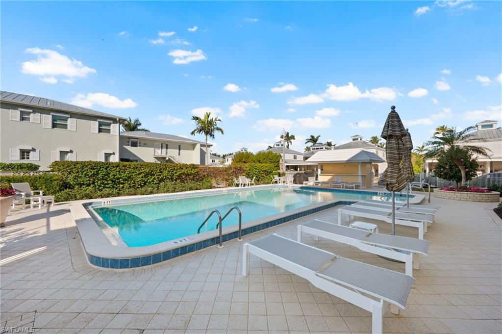 666 3rd Street South, Unit 106 Naples, FL 34102 - Photo 27 of 32 a view of outdoor space and swimming pool