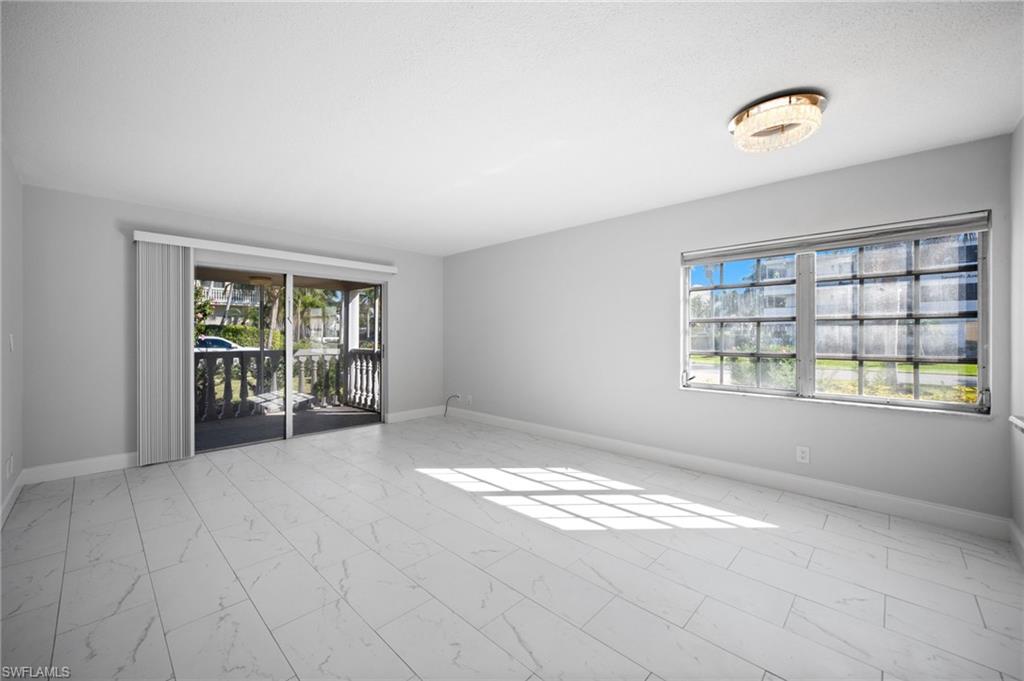 666 3rd Street South, Unit 106 Naples, FL 34102 - Photo 3 of 32 a view of an empty room with a window