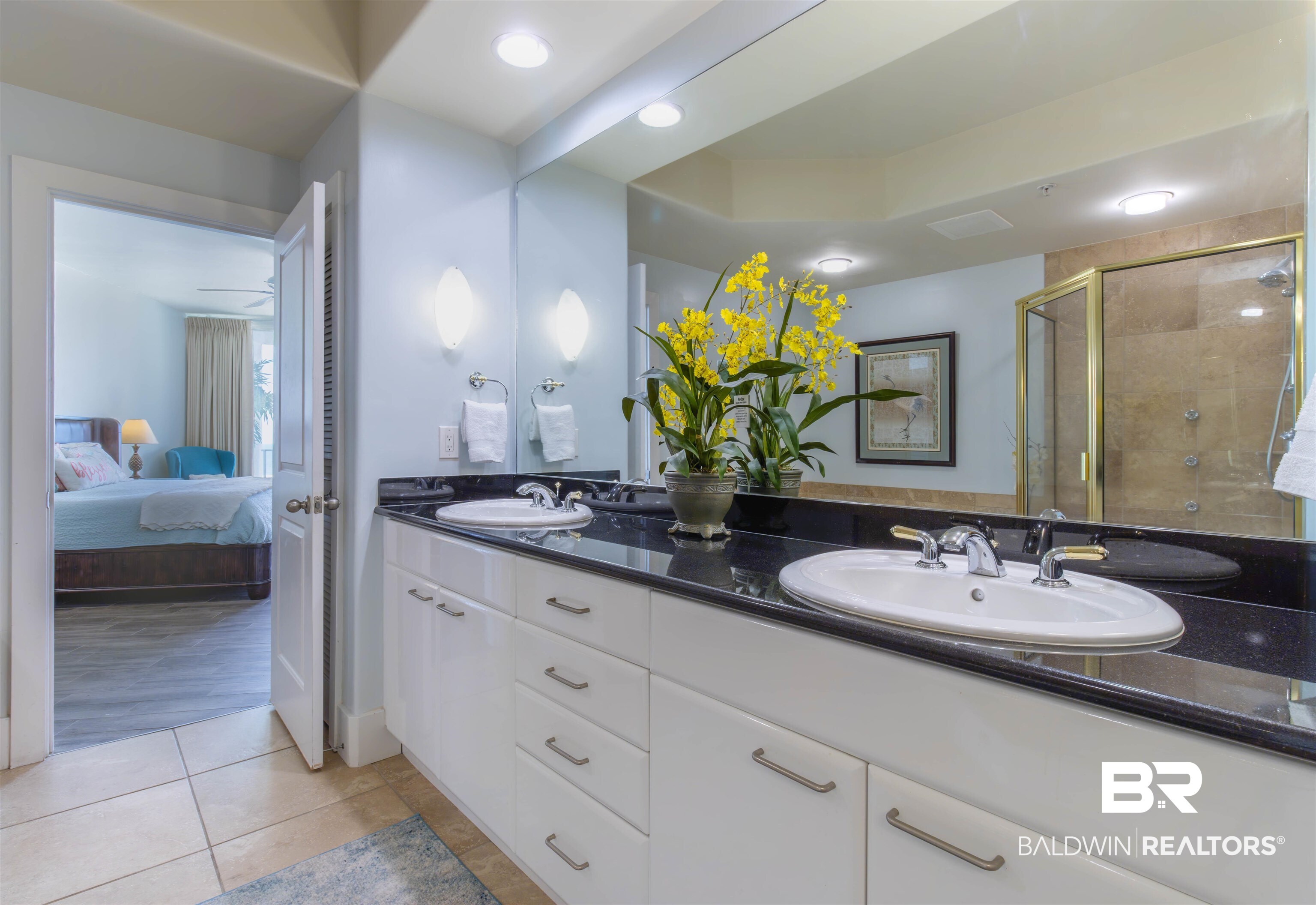 28107 Perdido Beach Boulevard, Unit D714 Orange Beach, AL 36561 - Photo 36 of 88 Ensuite bathroom featuring tile patterned flooring, a stall shower, ensuite bathroom, and a sink