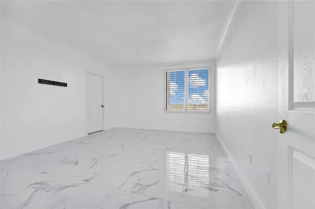 a bathroom with a toilet a sink a mirror a vanity and shower