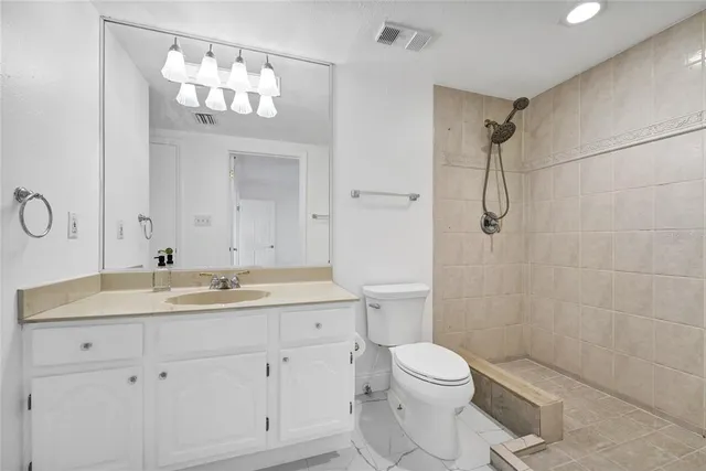 a view of walk in closet with cabinet