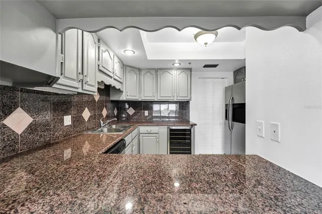 a view of a hallway with wooden shelves
