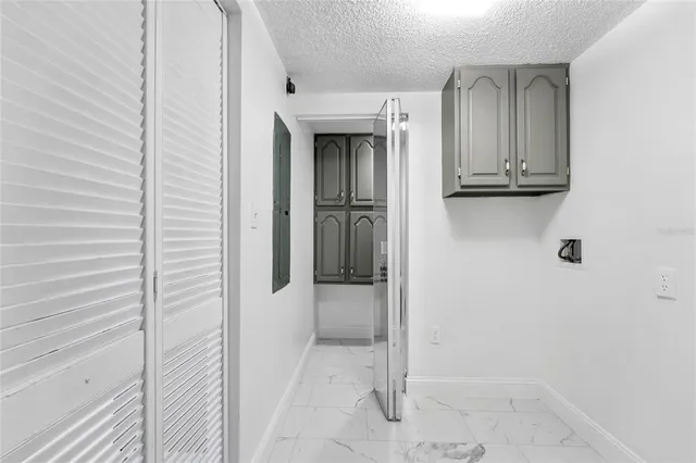 a view of a storage and utility room with washer and dryer