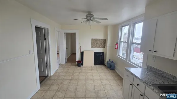 a view of a kitchen with a sink cabinets and a window