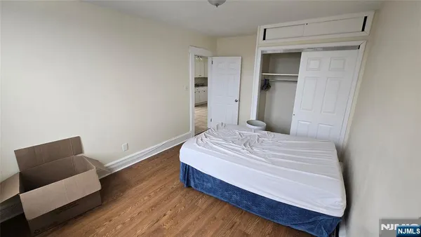 a bedroom with a bed and a chair