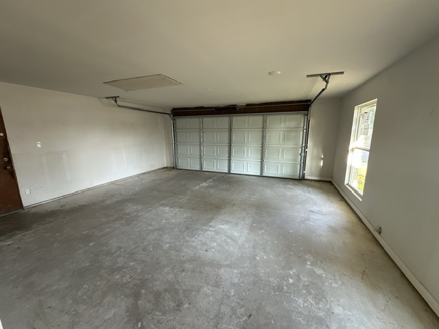 2101 Vanderbilt Lane Austin, TX 78723 - Photo 4 of 25 Garage featuring baseboards