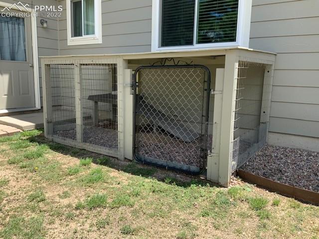 8460 Tibbs Road Peyton, CO 80831 - Photo 36 of 37 Dog run with door out the office