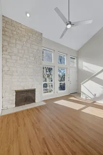 wooden floor in an empty room with a fireplace