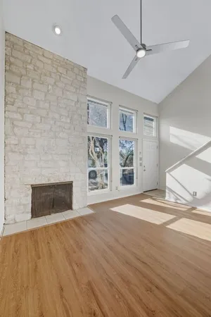 wooden floor in an empty room with a fireplace