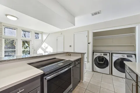 a kitchen with a stove and a sink