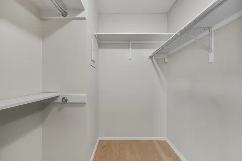 a white bath tub sitting next to a white toilet and sink