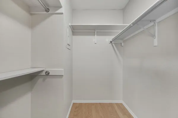 a white bath tub sitting next to a white toilet and sink