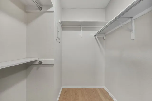 a white bath tub sitting next to a white toilet and sink