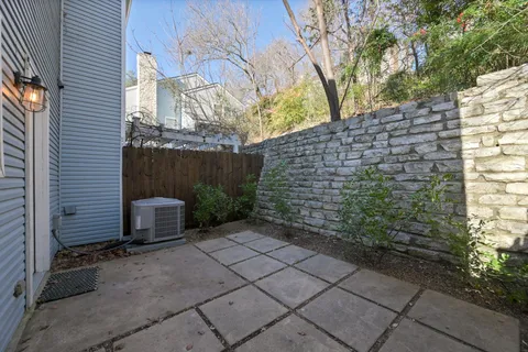 a picture of a bench in front of a wall