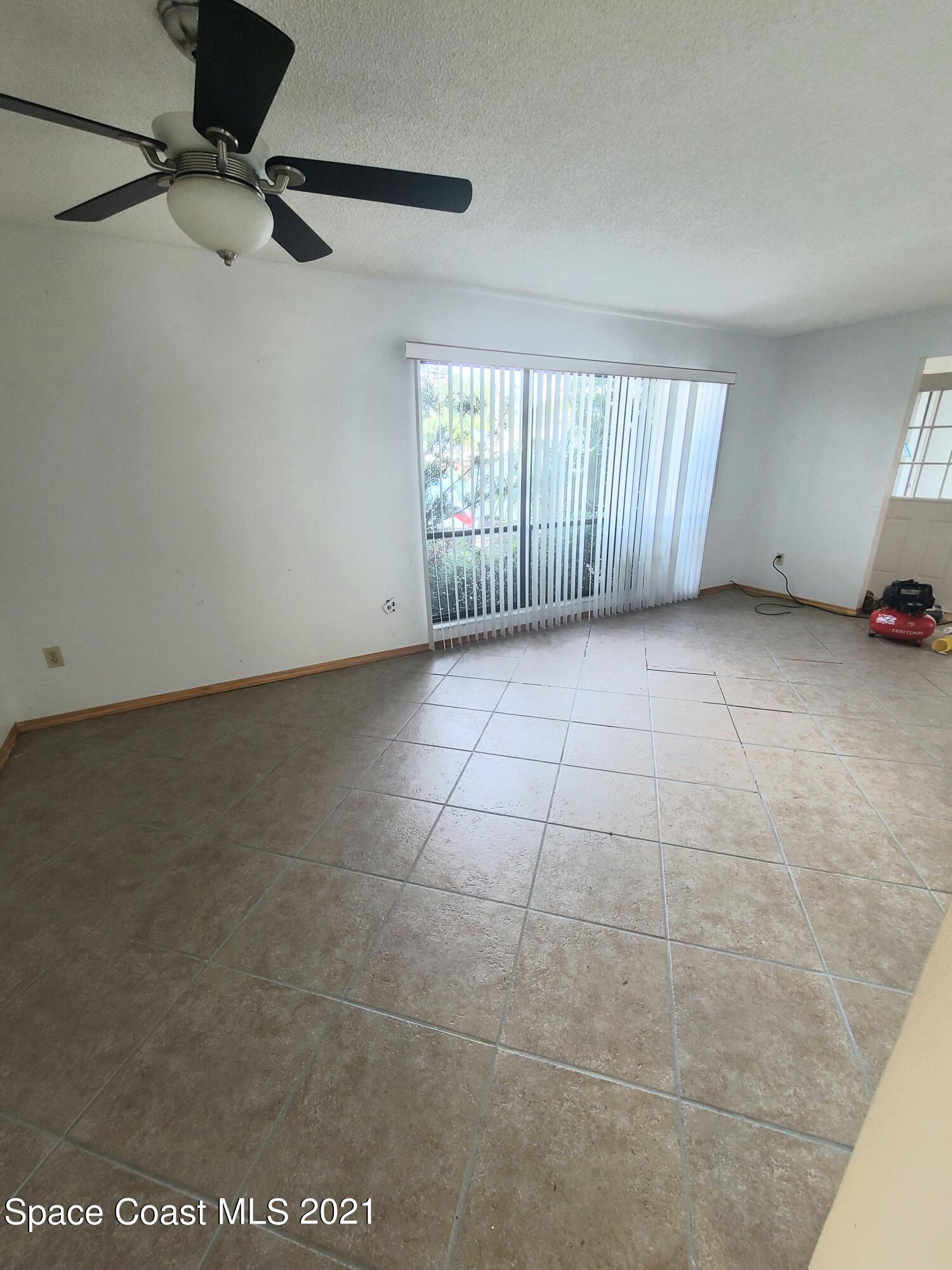 292 Chase Road Cocoa, FL 32927 - Photo 2 of 17 a view of an empty room with a window