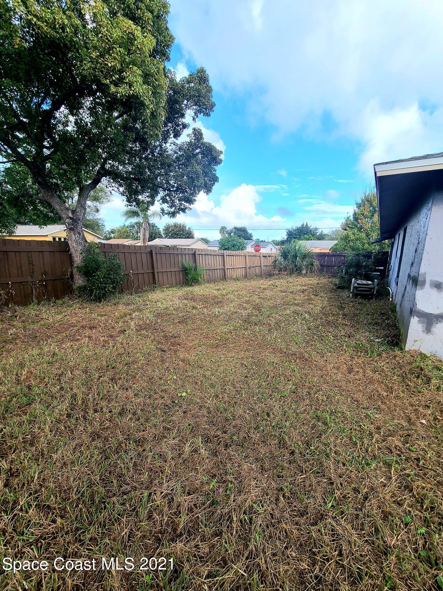 292 Chase Road Cocoa, FL 32927 - Photo 15 of 17 a view of a yard