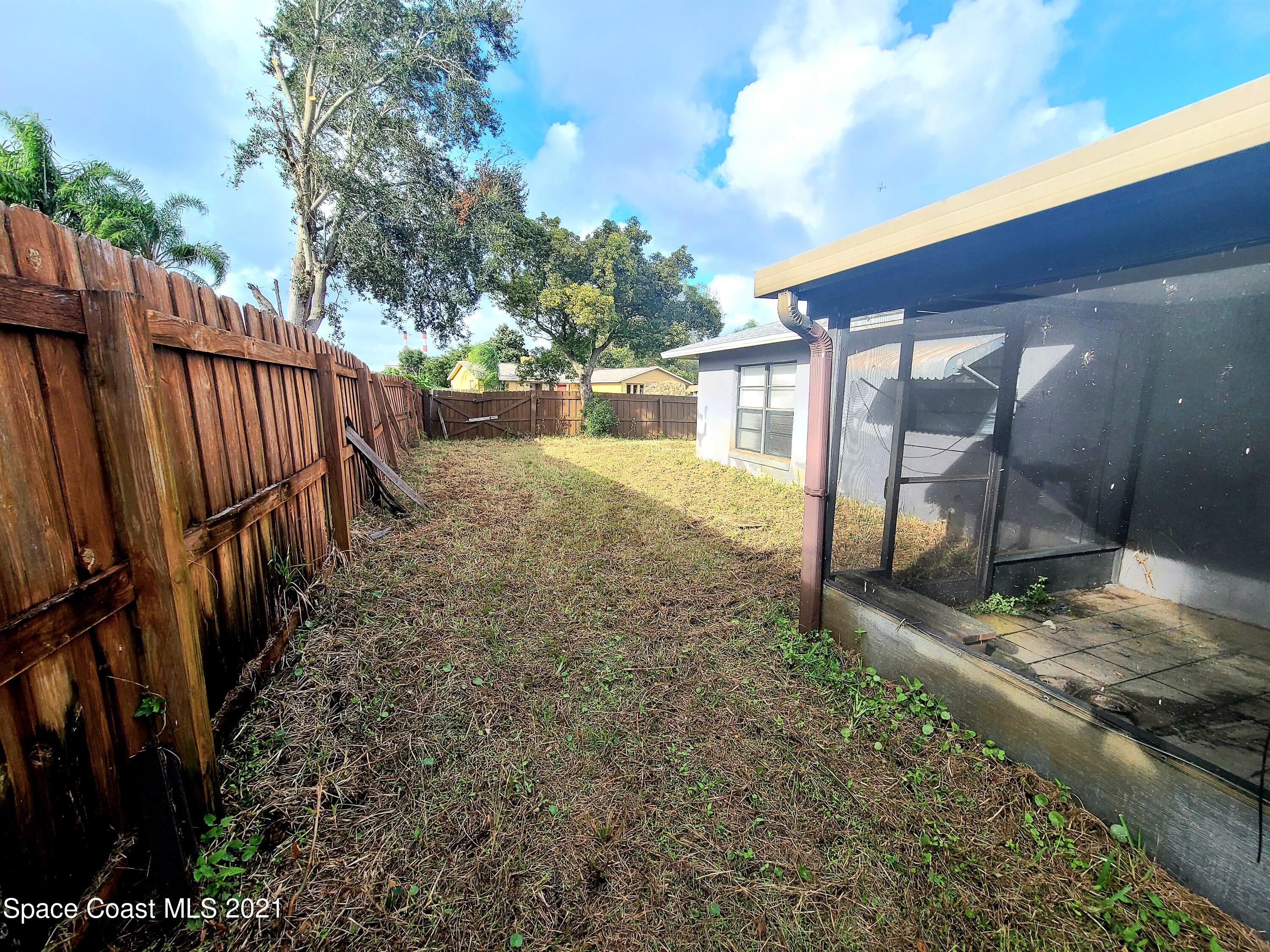 292 Chase Road Cocoa, FL 32927 - Photo 16 of 17 a view of a backyard