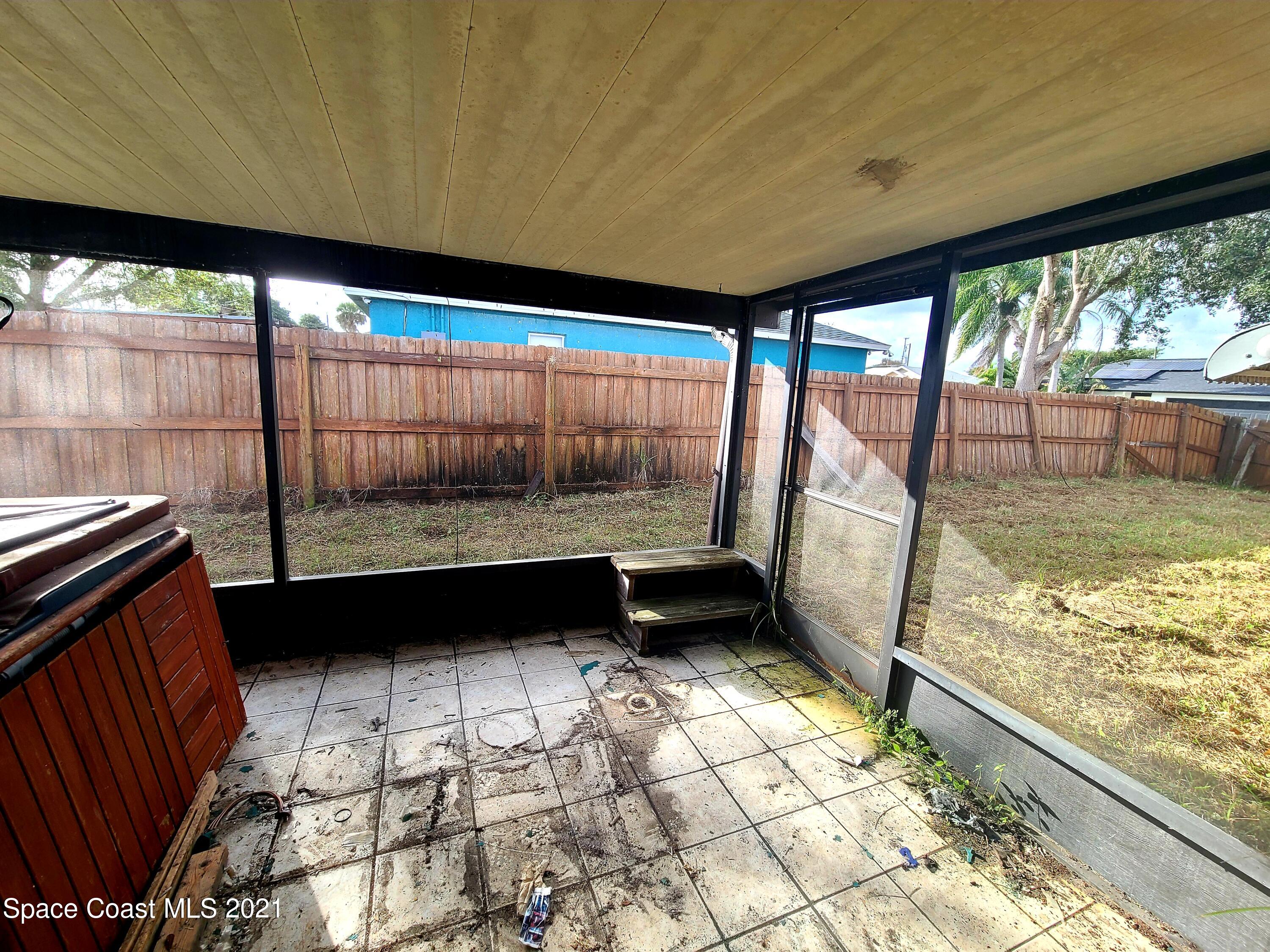 292 Chase Road Cocoa, FL 32927 - Photo 17 of 17 a view of an empty room with a large window