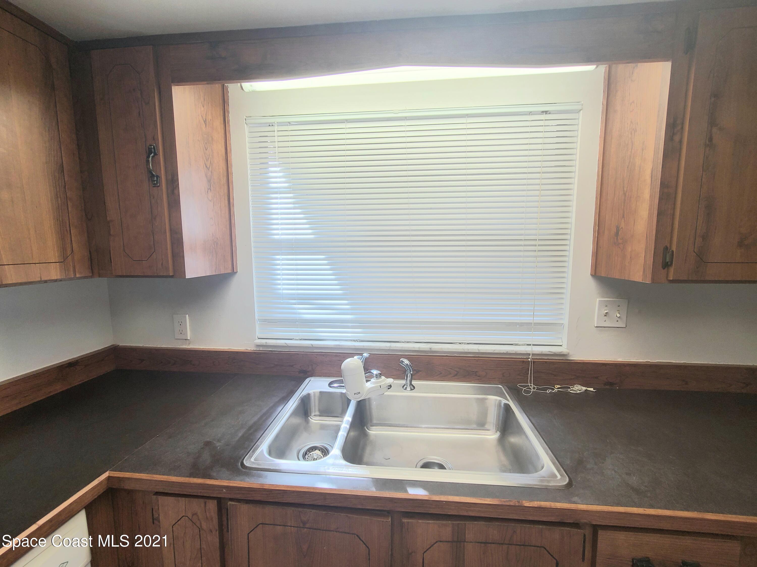 292 Chase Road Cocoa, FL 32927 - Photo 9 of 17 a sink with a window