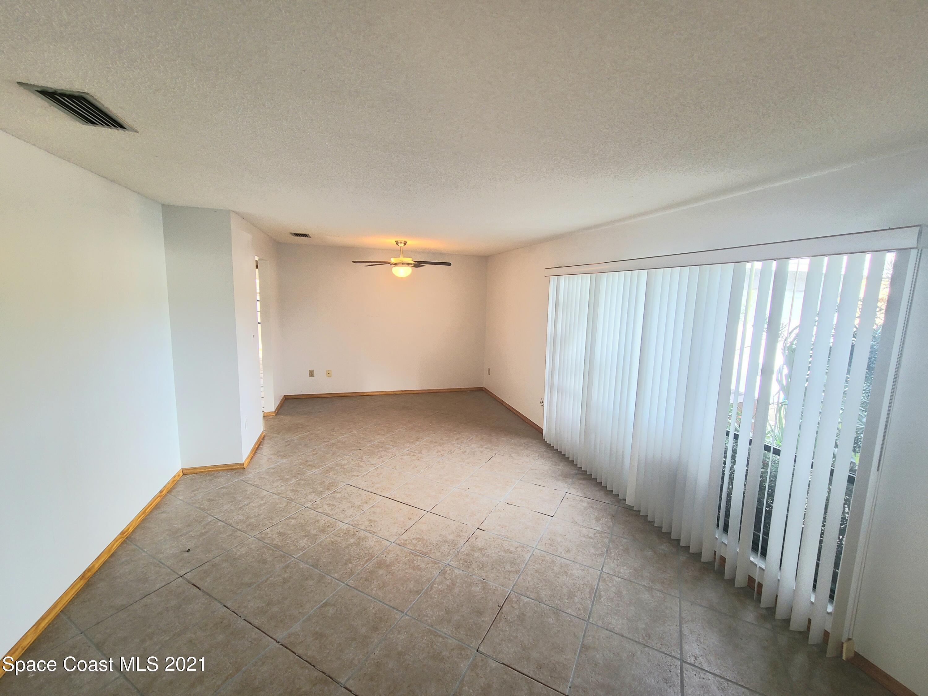 292 Chase Road Cocoa, FL 32927 - Photo 10 of 17 a view of an empty room with a window