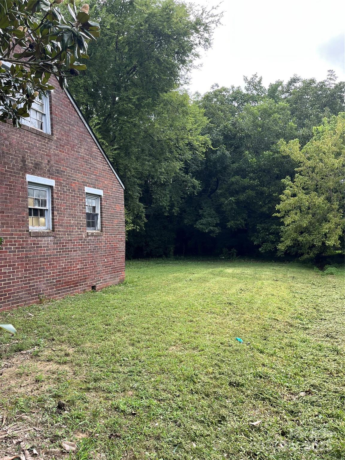218 South Main Street Wingate, NC 28174 - Photo 5 of 5 a view of a backyard with a garden