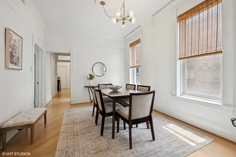 a view of a dining room with furniture and window