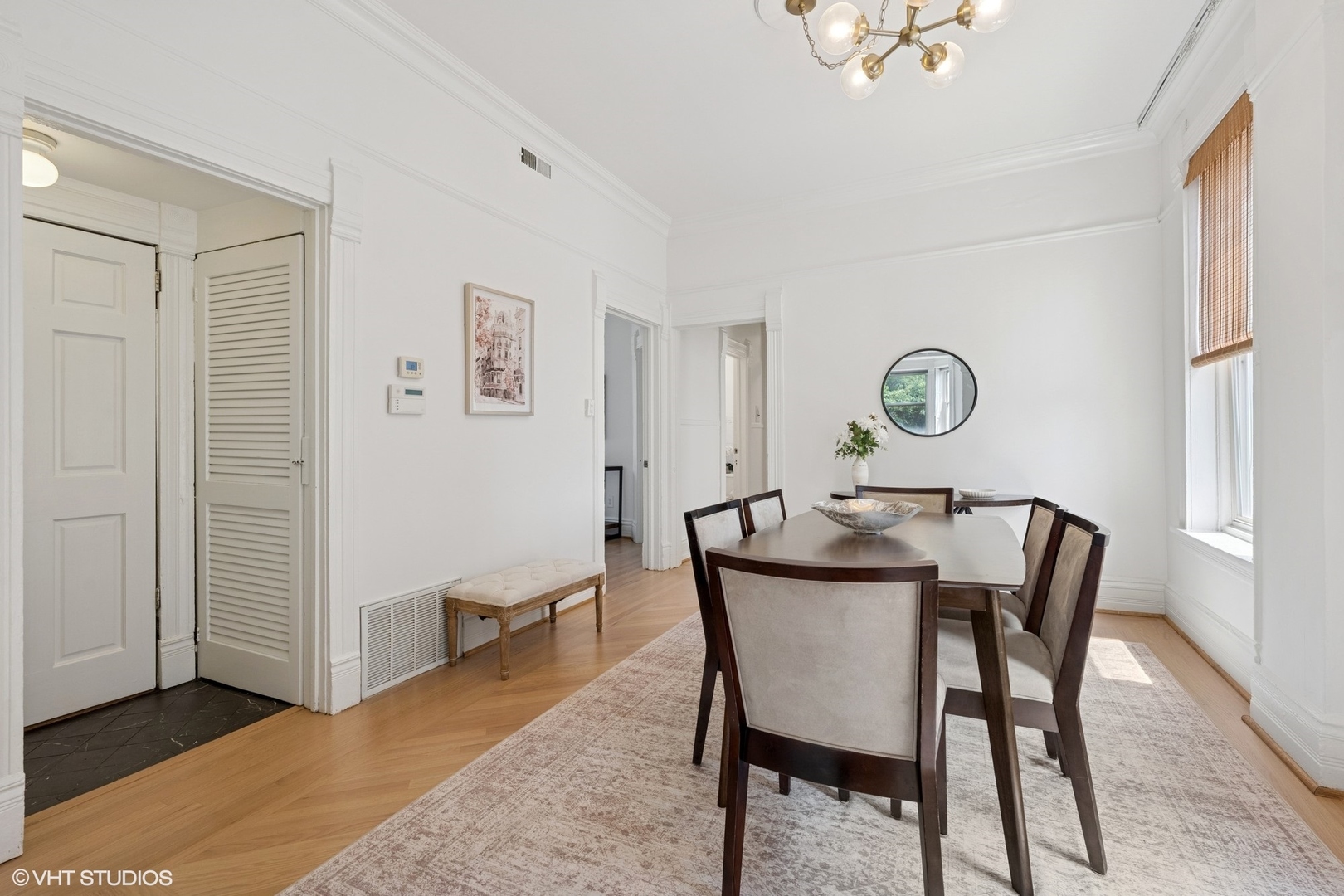 1411 North Wells Street, Unit 3W Chicago, IL 60610 - Photo 15 of 32 a view of a dining room with furniture and a window