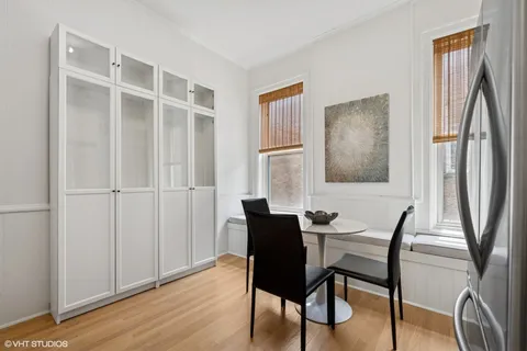 a dining room with furniture and window