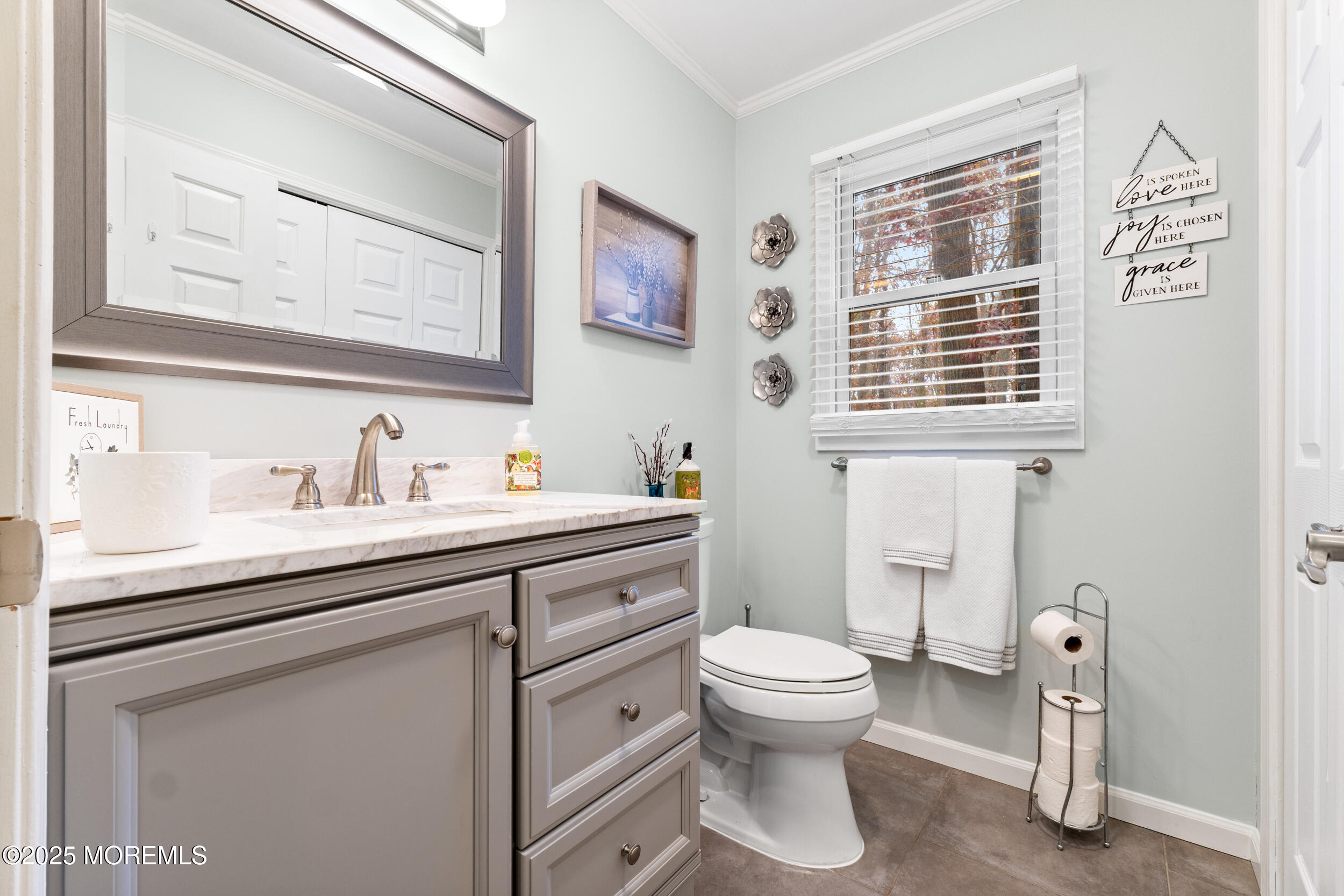 1418 Forest Avenue Brick, NJ 08724 - Photo 16 of 47 a bathroom with a toilet sink and mirror