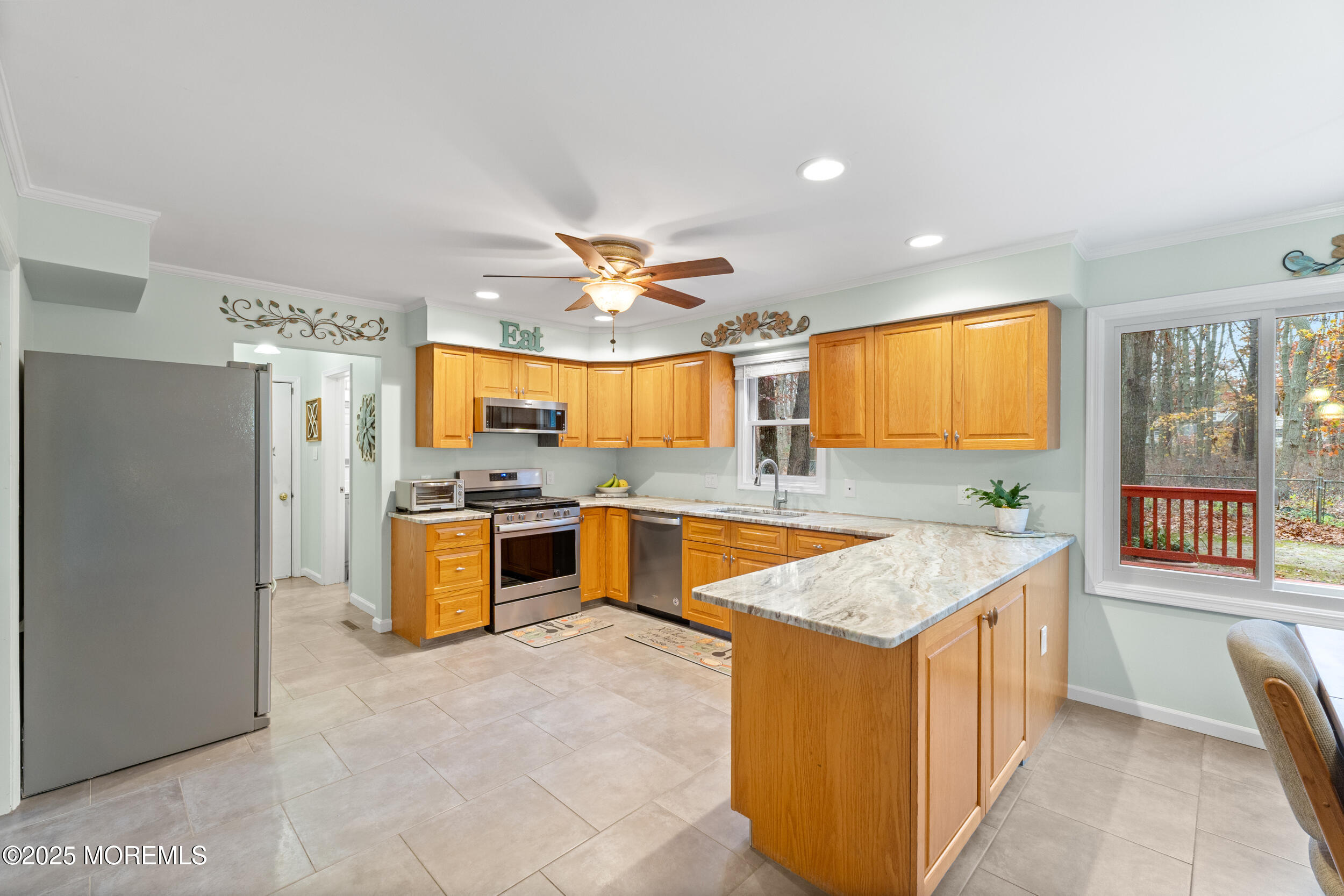 1418 Forest Avenue Brick, NJ 08724 - Photo 18 of 47 a large kitchen with stainless steel appliances granite countertop a large counter top and a stove