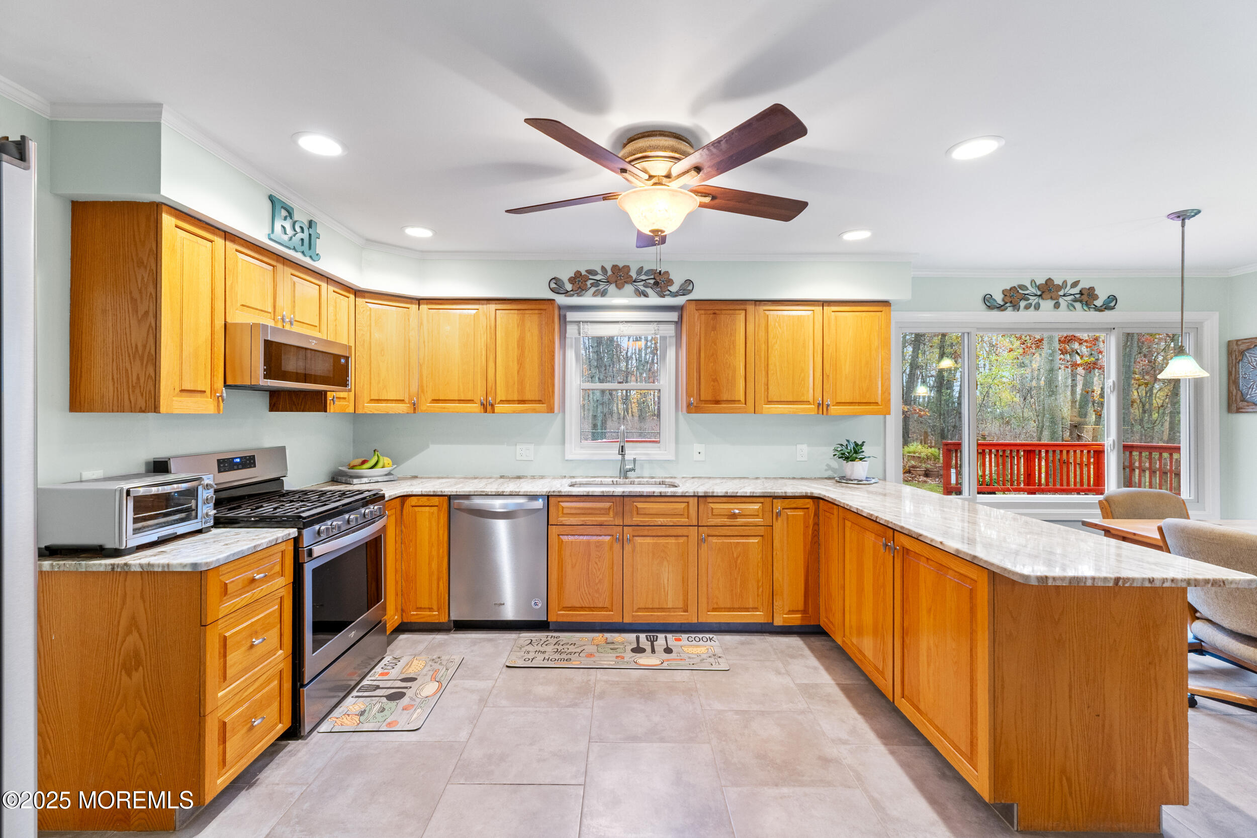 1418 Forest Avenue Brick, NJ 08724 - Photo 19 of 47 a kitchen with stainless steel appliances granite countertop a sink and a refrigerator