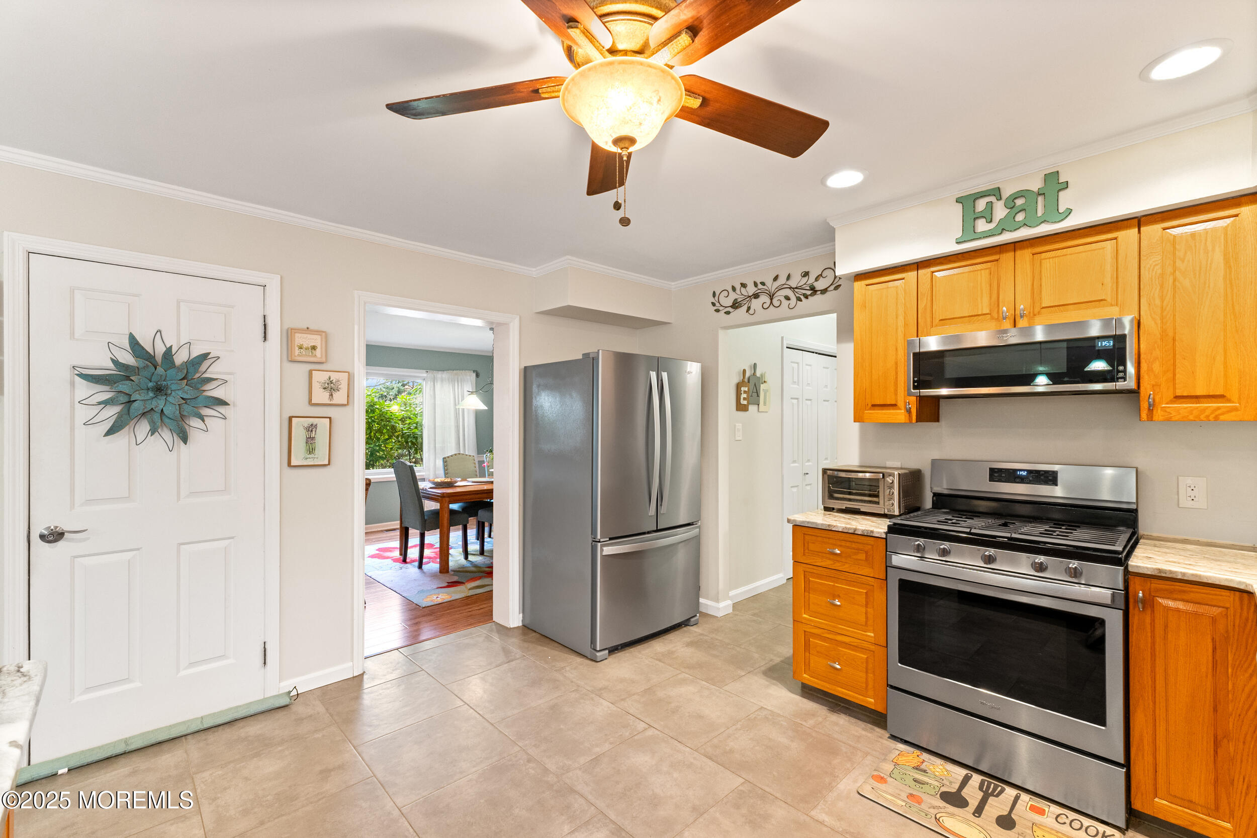 1418 Forest Avenue Brick, NJ 08724 - Photo 21 of 47 a kitchen with stainless steel appliances a stove a refrigerator and a sink