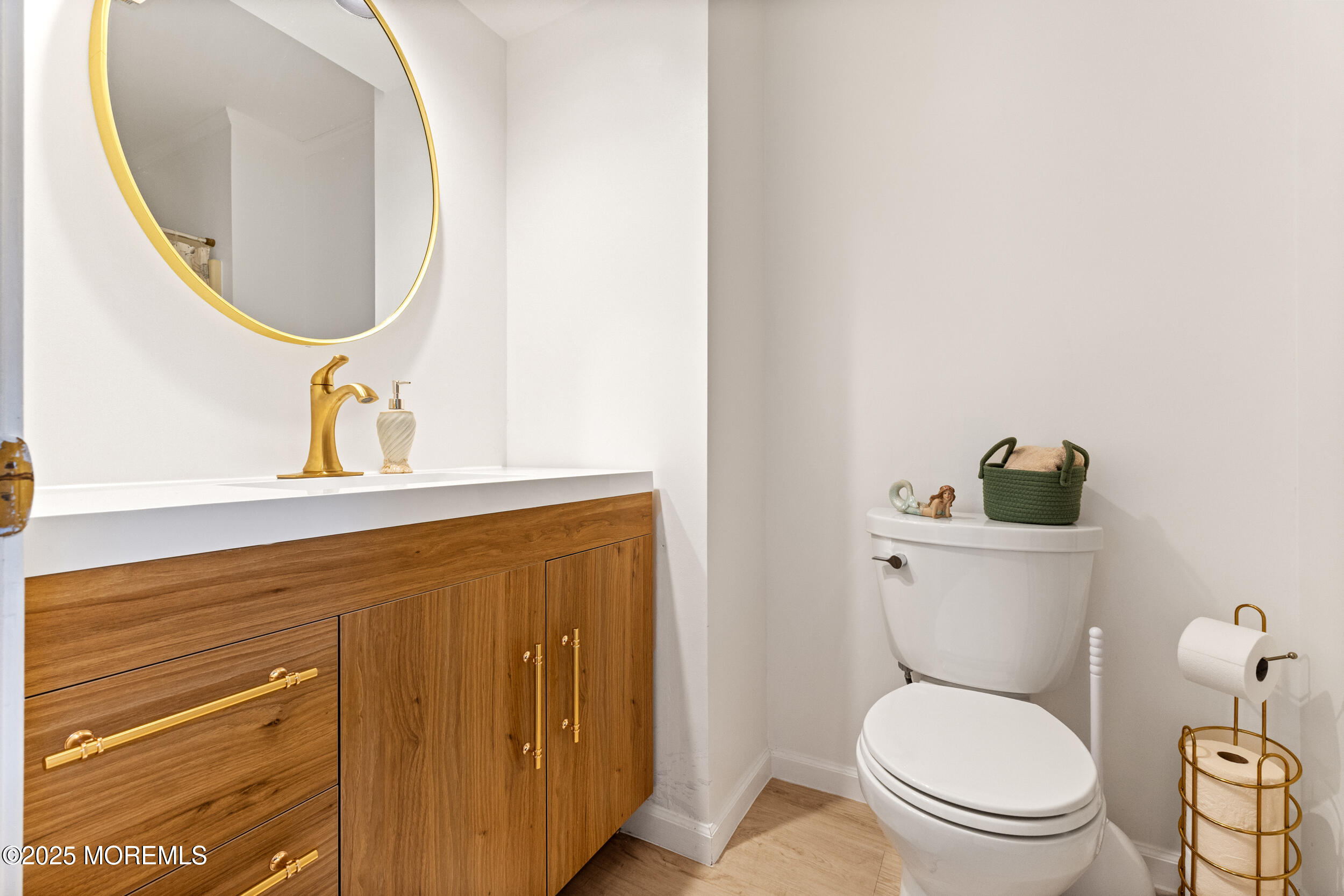 1418 Forest Avenue Brick, NJ 08724 - Photo 28 of 47 a bathroom with a toilet a sink and mirror