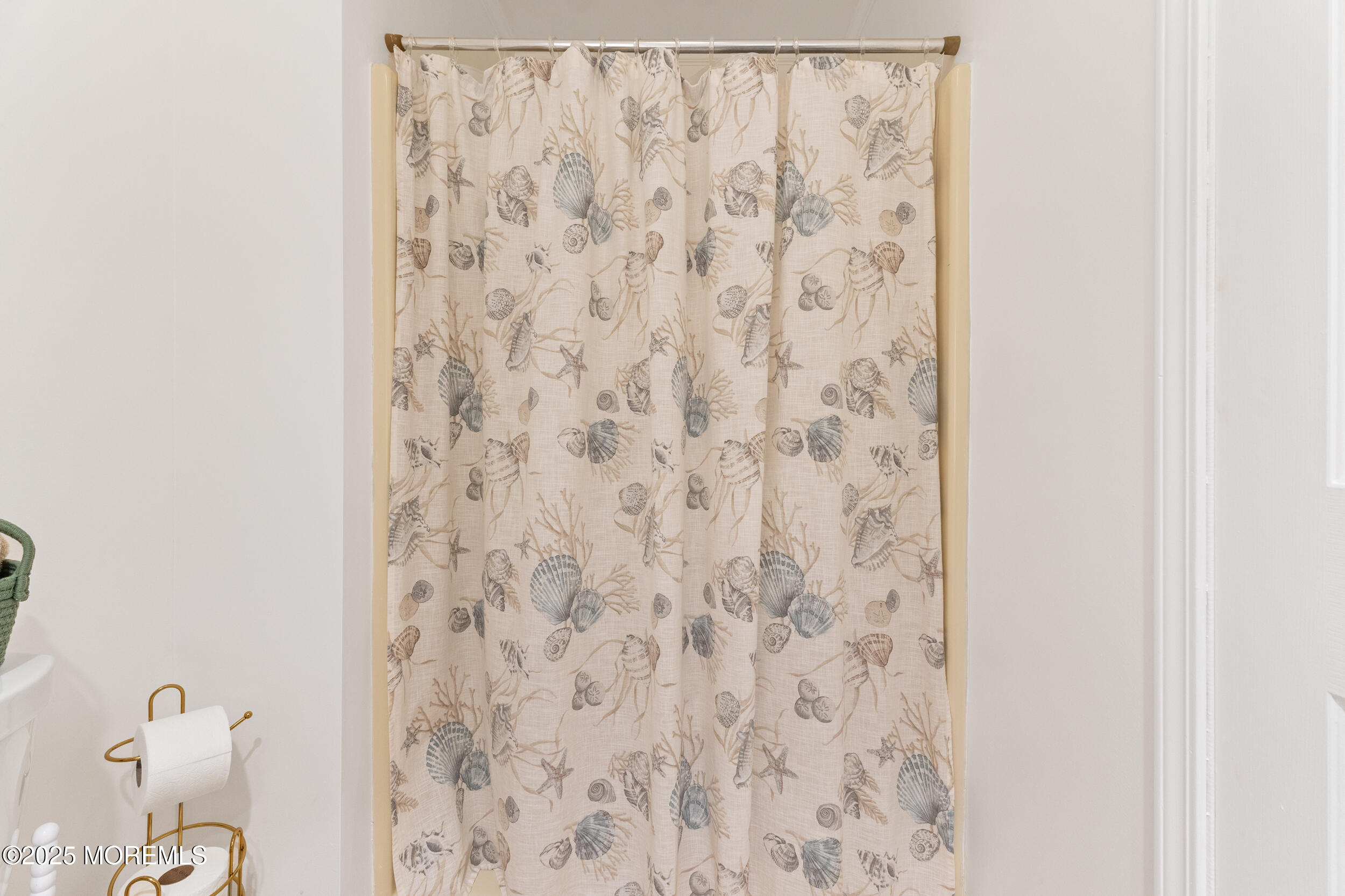 1418 Forest Avenue Brick, NJ 08724 - Photo 29 of 47 a bathroom with a shower curtain and a curtain