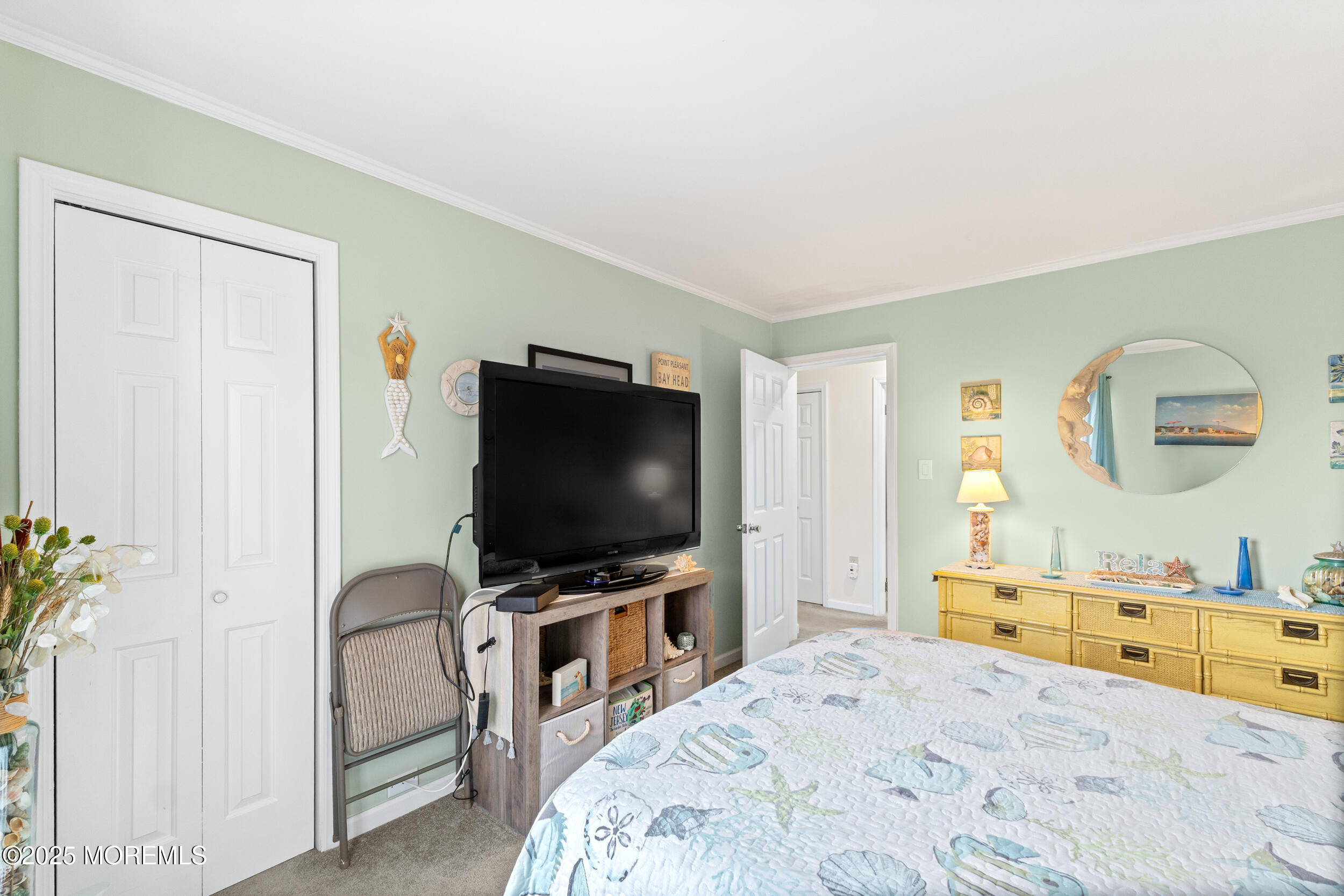 1418 Forest Avenue Brick, NJ 08724 - Photo 35 of 47 a bedroom with a bed and a flat screen tv