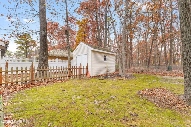 a view of swimming pool with outdoor seating and yard