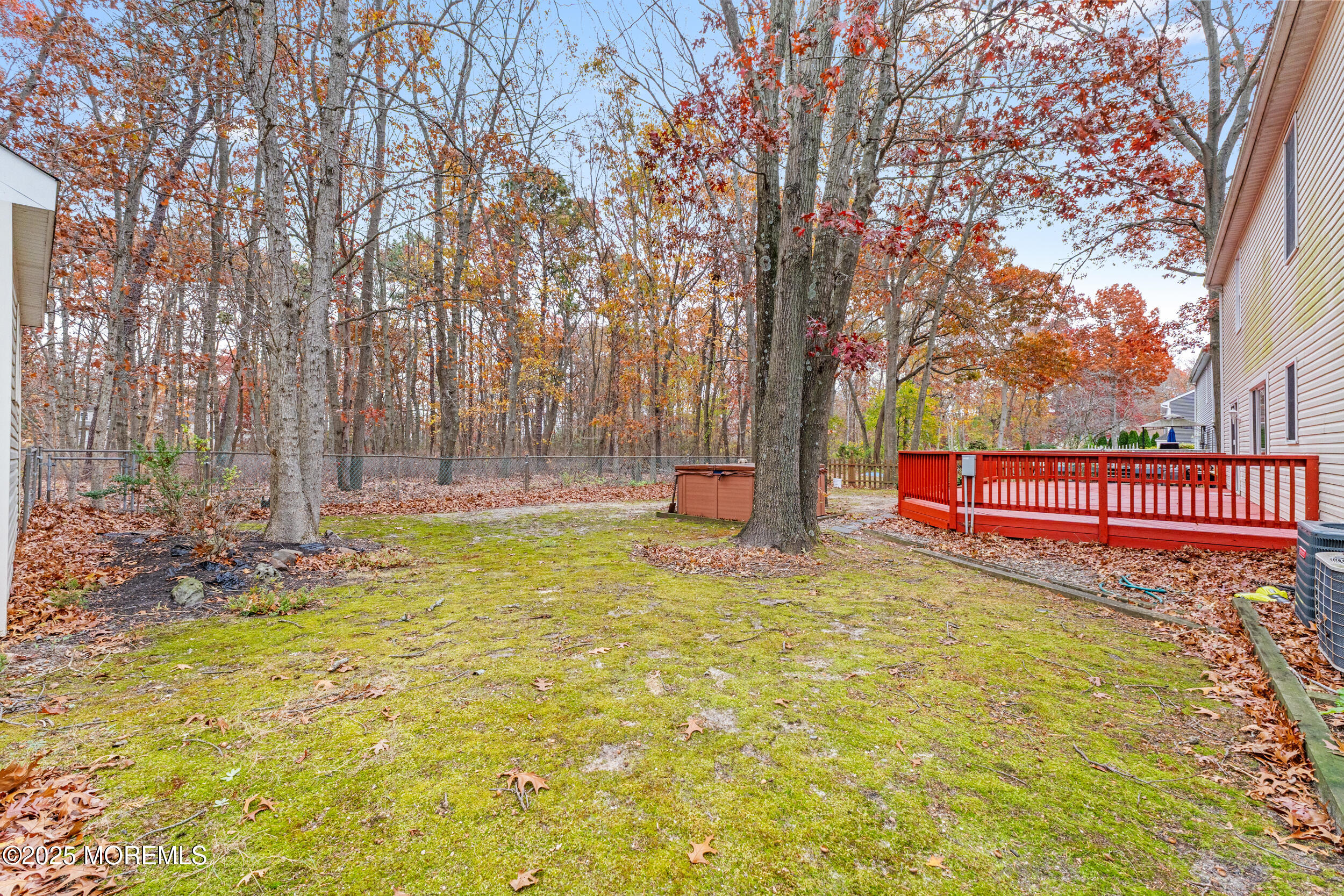 1418 Forest Avenue Brick, NJ 08724 - Photo 44 of 47 a backyard of a house with swimming pool and brick wall