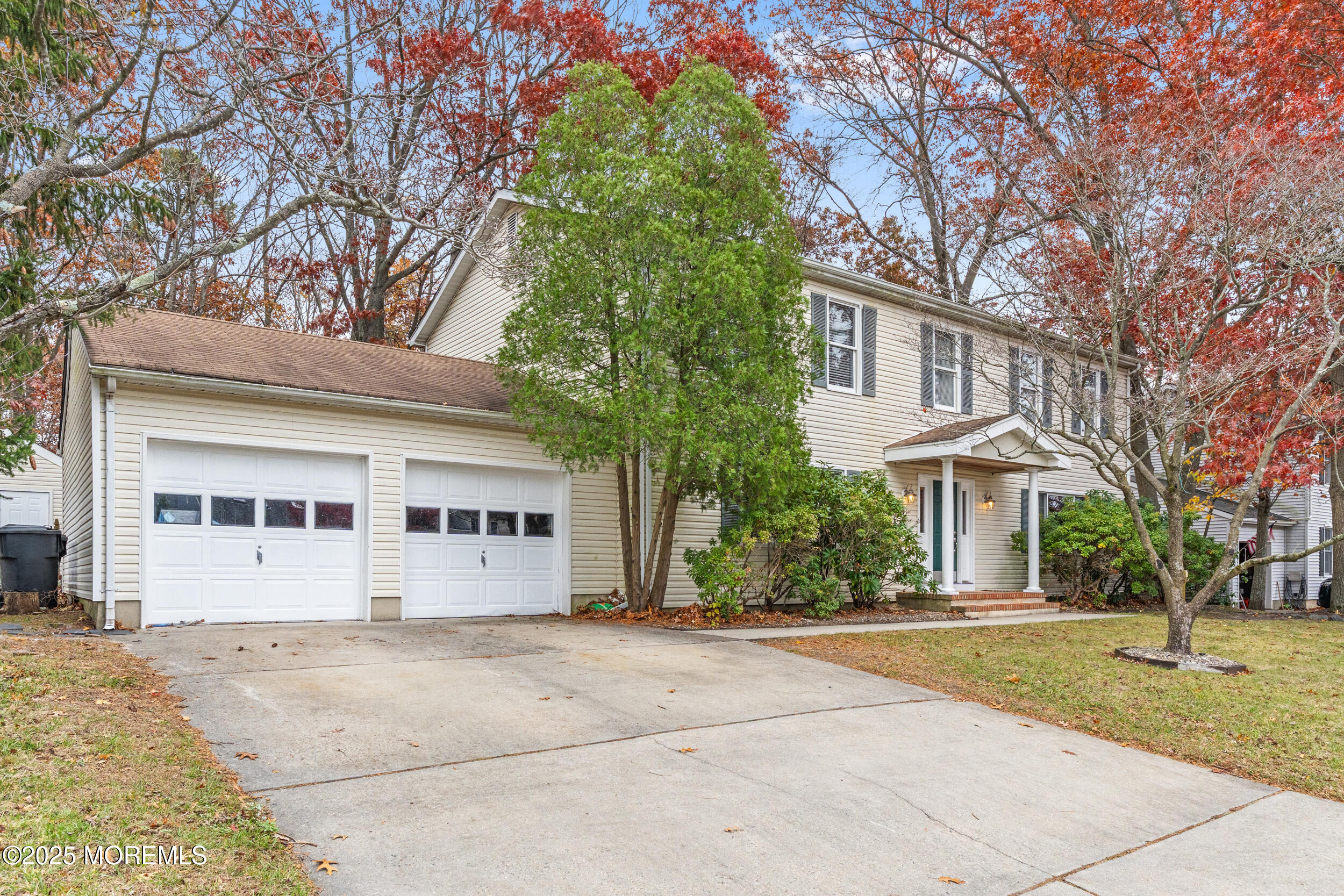 1418 Forest Avenue Brick, NJ 08724 - Photo 5 of 47 a view of a white house with a large tree