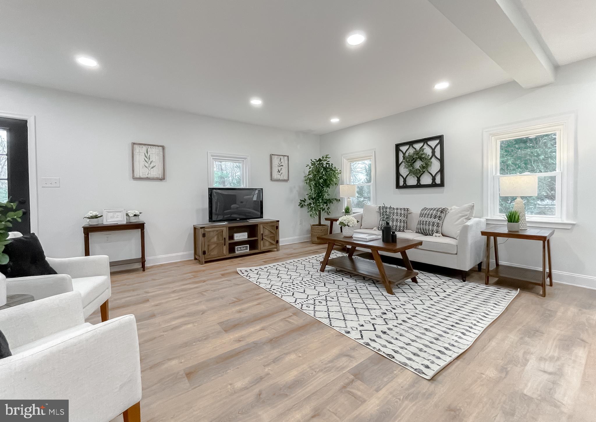 8285 Verne Place Welcome, MD 20693 - Photo 11 of 54 a living room with furniture and a rug