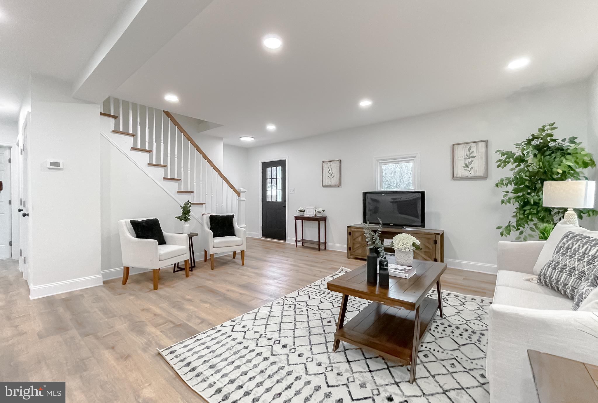 8285 Verne Place Welcome, MD 20693 - Photo 13 of 54 a living room with furniture and a flat screen tv