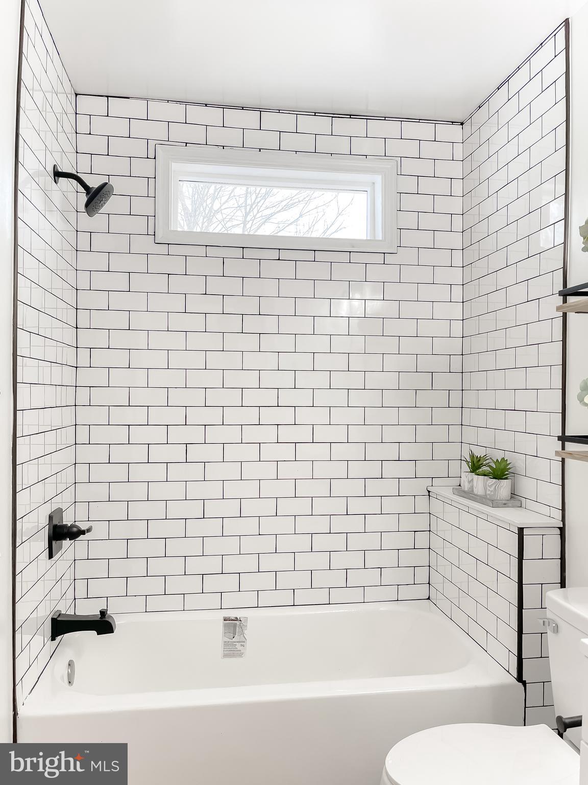 8285 Verne Place Welcome, MD 20693 - Photo 27 of 54 a bathroom with a bathtub and a shower