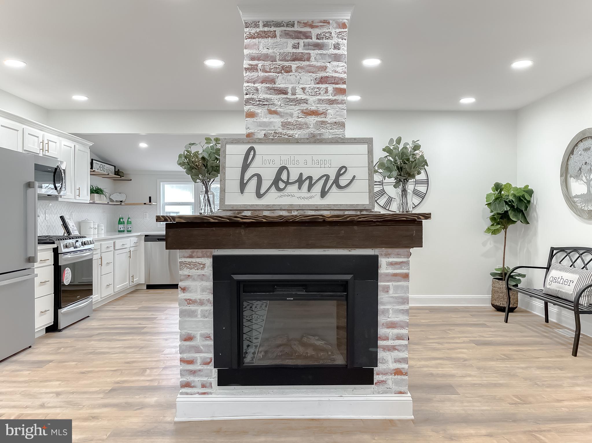 8285 Verne Place Welcome, MD 20693 - Photo 3 of 54 a open kitchen view with stainless steel appliances granite countertop a stove top oven