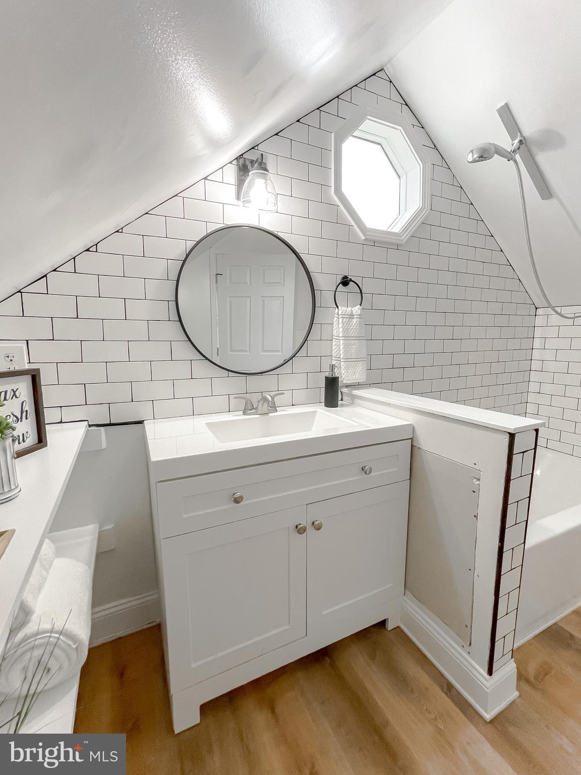 8285 Verne Place Welcome, MD 20693 - Photo 32 of 54 a bathroom with a double vanity sink mirror and toilet