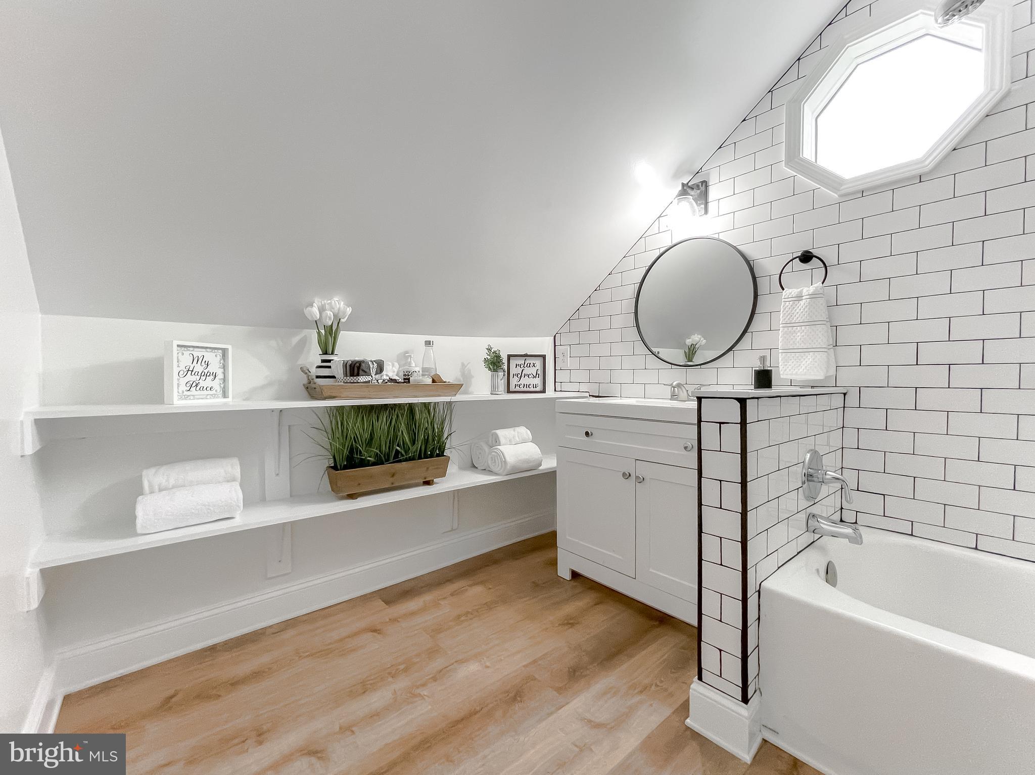 8285 Verne Place Welcome, MD 20693 - Photo 33 of 54 a bathroom with a double vanity sink mirror and bathtub