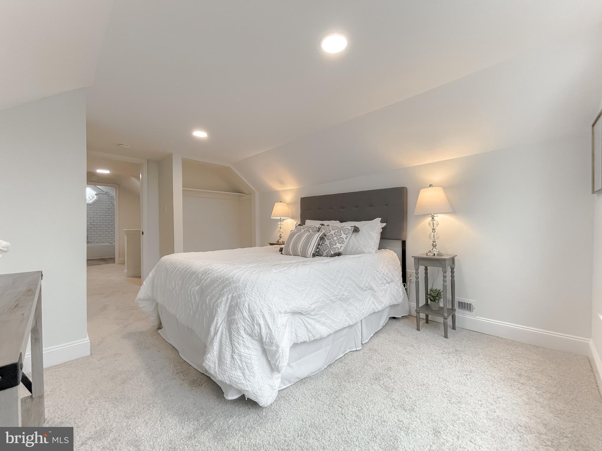 8285 Verne Place Welcome, MD 20693 - Photo 34 of 54 a bedroom with a bed and a lamp