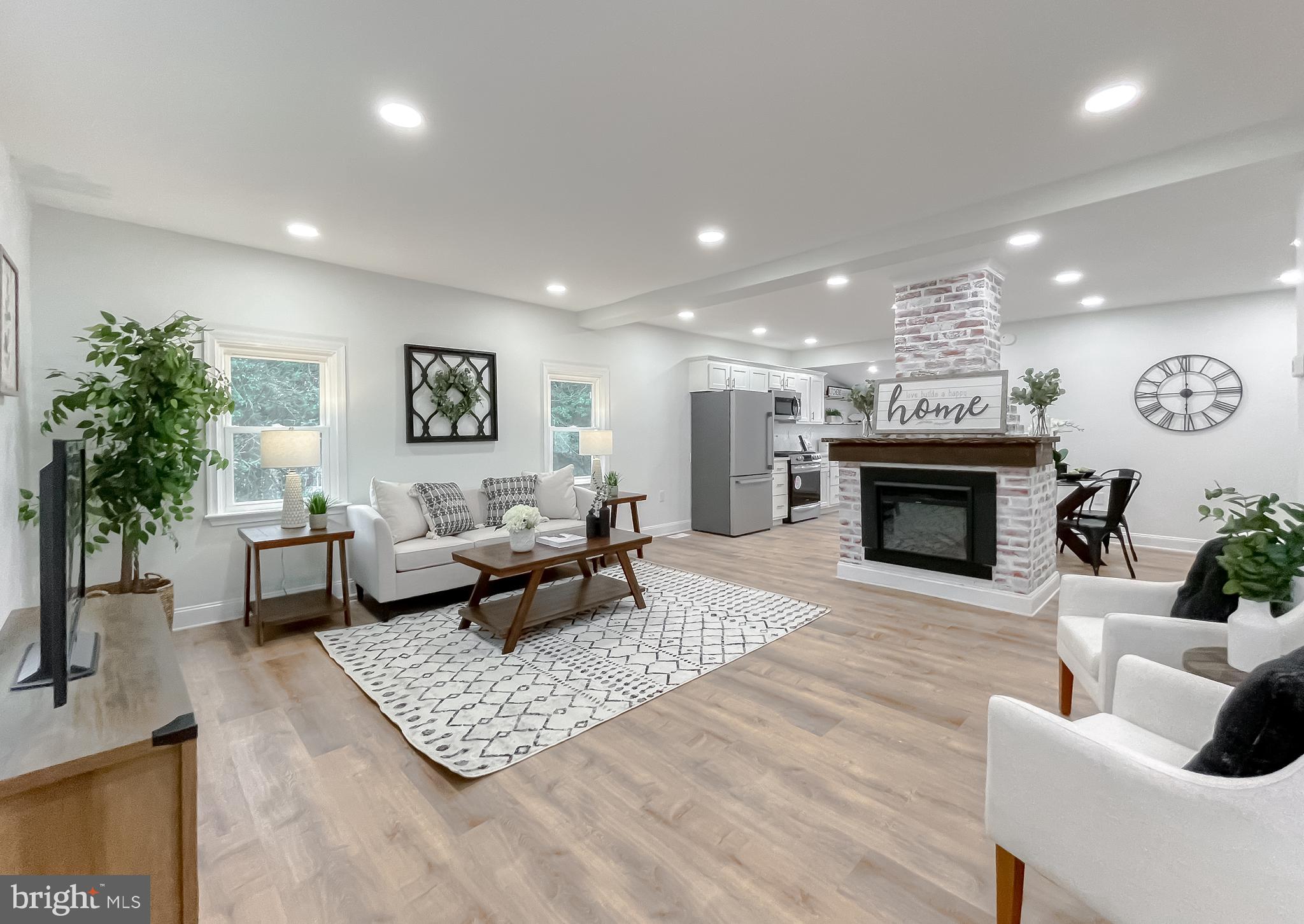 8285 Verne Place Welcome, MD 20693 - Photo 6 of 54 a living room with furniture and a fireplace