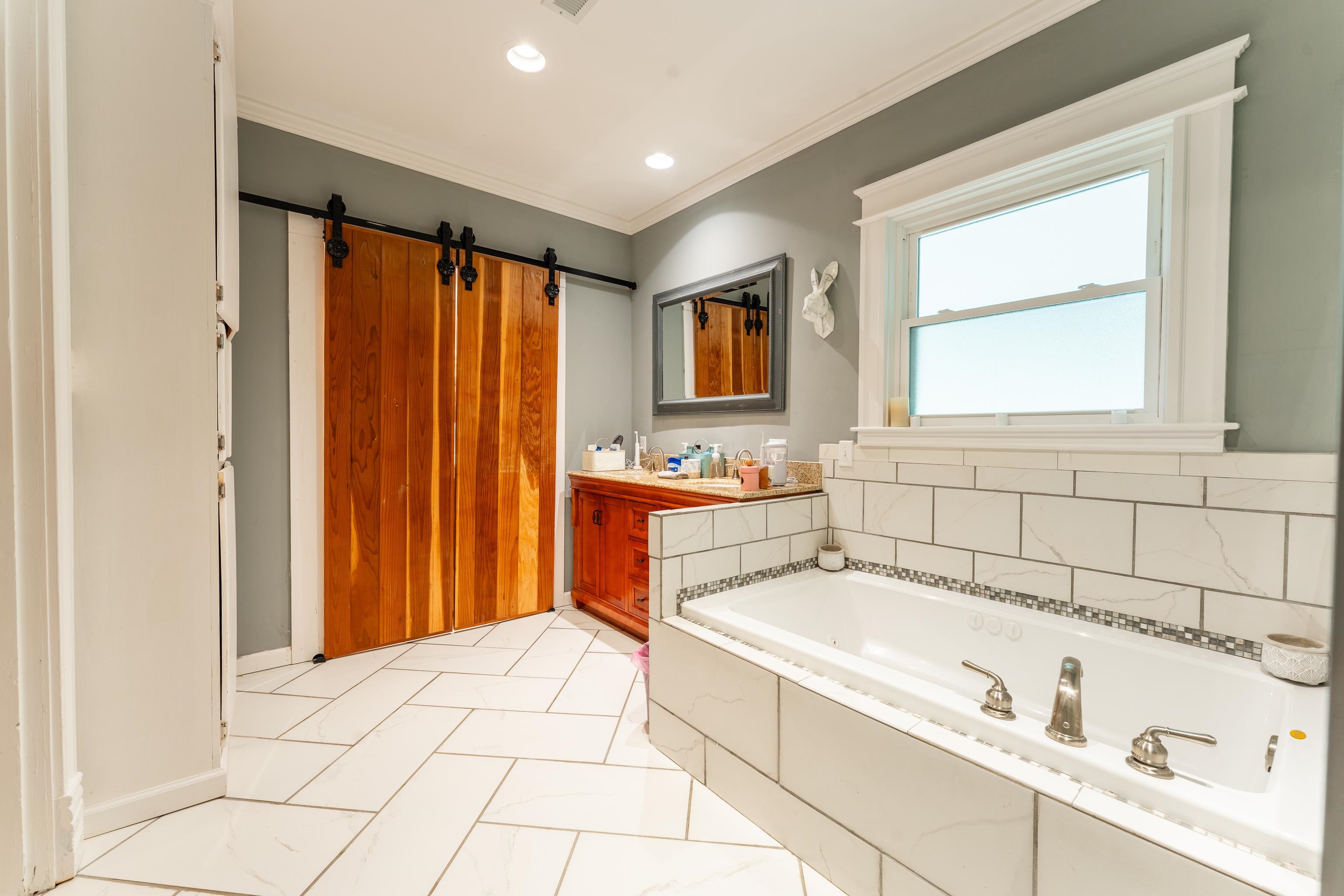 171 White Street Savannah, TN 38372 - Photo 12 of 36 a bathroom with a bathtub and a sink