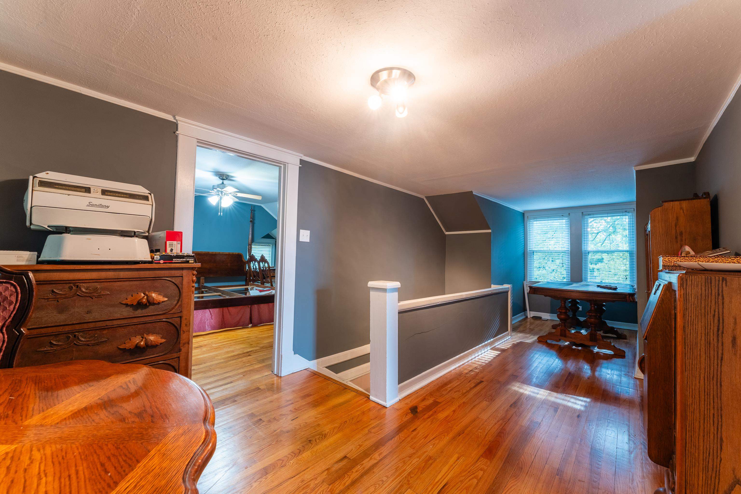 171 White Street Savannah, TN 38372 - Photo 21 of 36 a living room with furniture and a flat screen tv